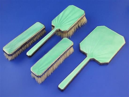 A 1930s Art Deco silver and green guilloche enamel four piece dressing table set by Mappin & Webb,